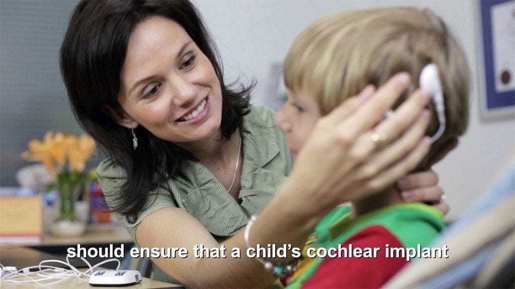 Innovative Training Videos for Eduplex Training Institute An Audiologist demonstrates the removal of a child's cochlear implant hearing device in the training videos for ETI filmed by Zikedish